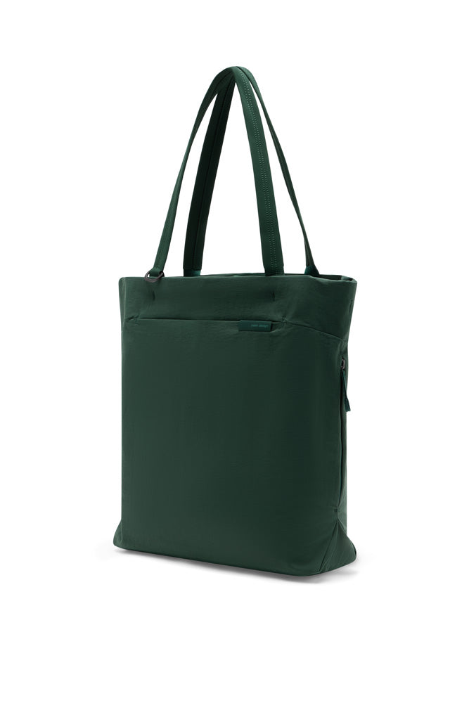 A dark green tote bag with dual shoulder straps, shown from a three-quarter angle against a plain white background.