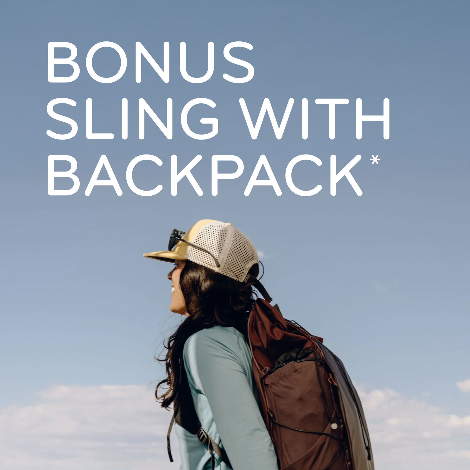 A woman outdoors wearing a beige trucker hat, light blue long-sleeve shirt, and a large brown hiking backpack, with large white text reading 'BONUS SLING WITH BACKPACK*' over a blue sky background. A small logo appears at the bottom right.