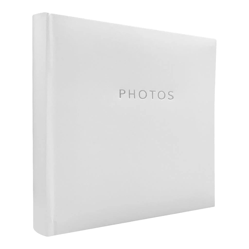 A white hardcover photo album with the word 'PHOTOS' printed in a subtle silver font on the front cover, shown at a three-quarter angle against a plain white background.