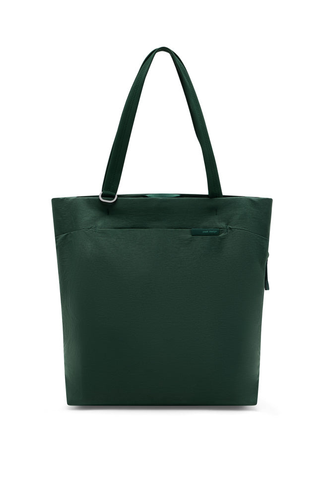 A dark green tote bag with two shoulder straps and a small horizontal zipper pocket on the front, shown against a plain white background.