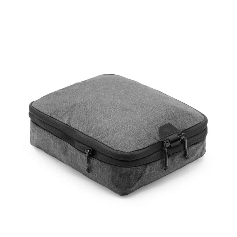 Gray travel bag with black zipper on a white background