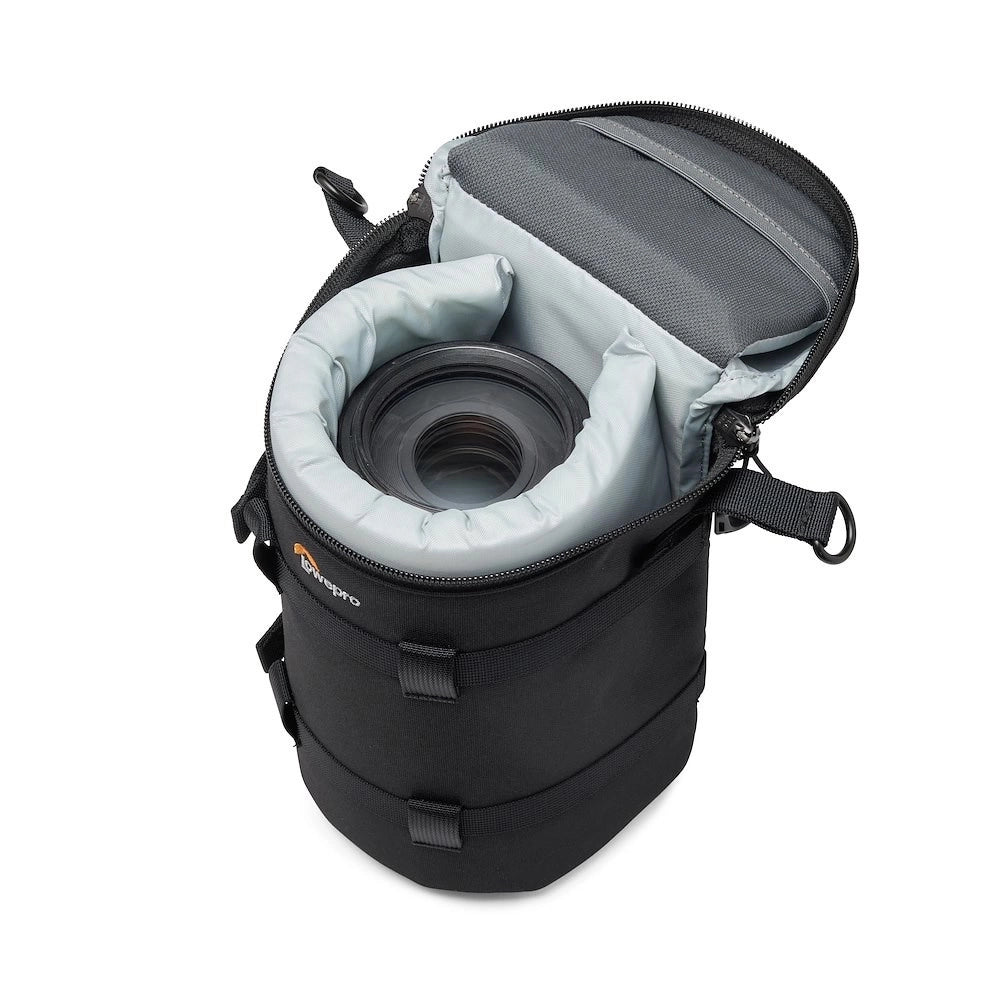 Camera lens in a black carrying case with gray interior on a white background