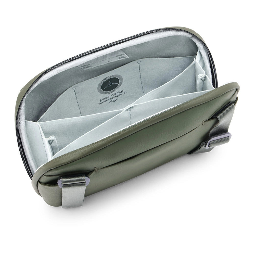 Open beige travel bag with a white interior on a white background